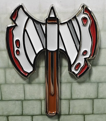 Soft enamel pin showing a double-sided battle axe in the colors of our Barbarian dice, which are red, white and brown,, and the pin also has added gray accents.